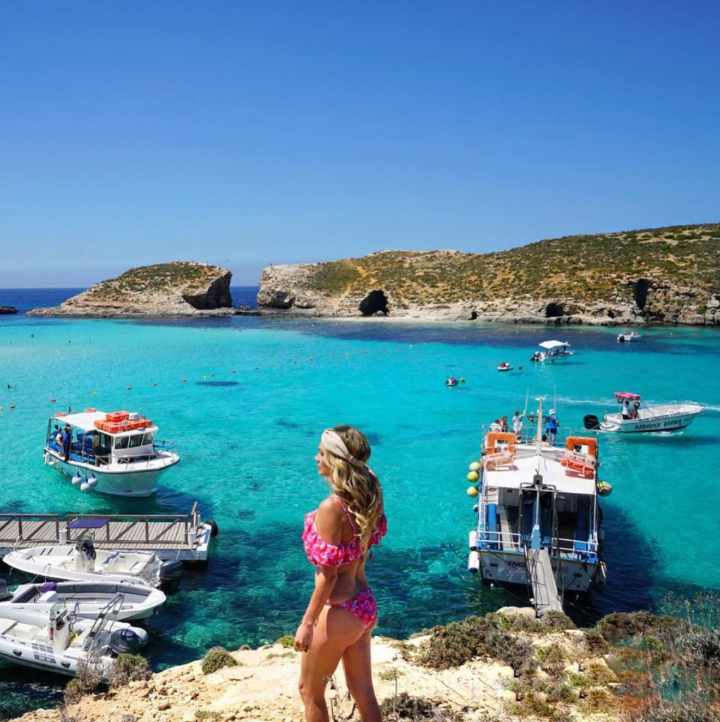 Female traveler in top European destination Malta, at the Blue Lagoon.